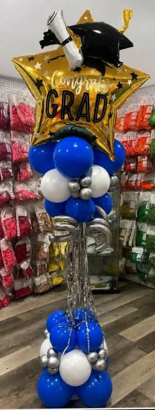Graduation balloon column in royal blue, white, and silver with 'Congrats Grad' gold star foil and cap/diploma topper