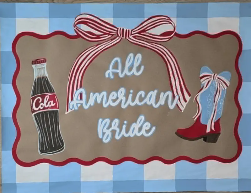 Hand-painted gingham banner: All American Bride with cola bottle, red cowboy boot, and striped bow