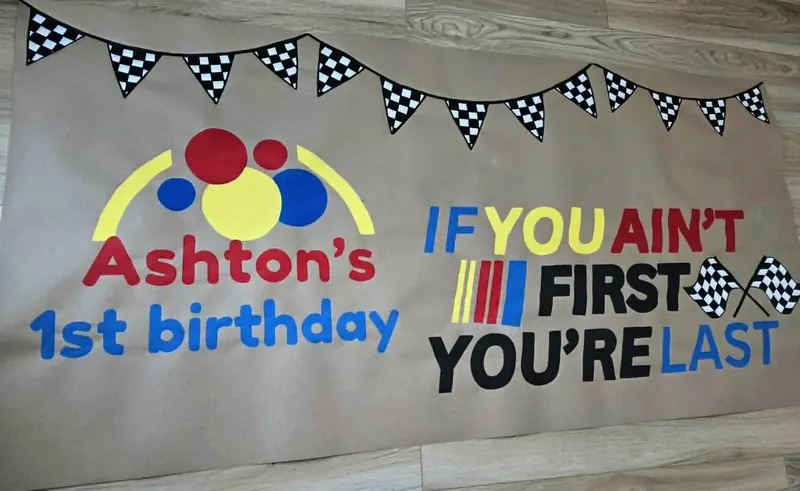 Hand-painted kraft banners: Ashton’s 1st Birthday and If You Ain’t First You’re Last racing theme